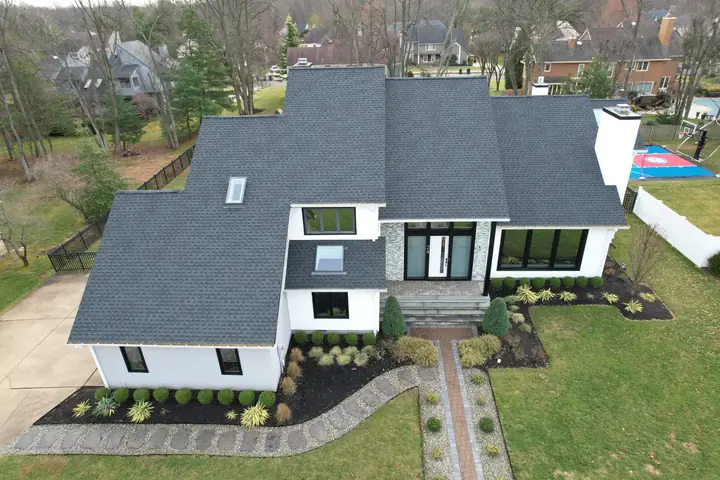 Completed charcoal roof on a modern white home
